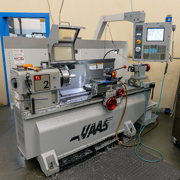 One of Werner Machine's HAAS manual lathes, which is used for shaping materials and for training team members