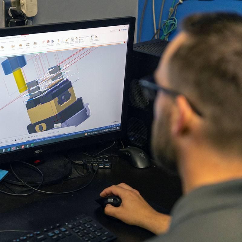 Werner Machine, a CNC Machine Shop in Marietta GA, employee uses CAD software to engineer and design a part for a manufacturing client.